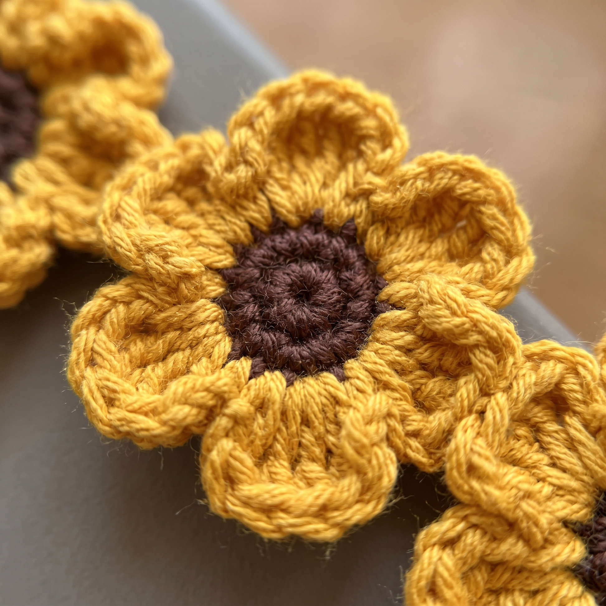 Orange Flower Chain Crochet Bookmark close-up showing crochet texture and handmade details
