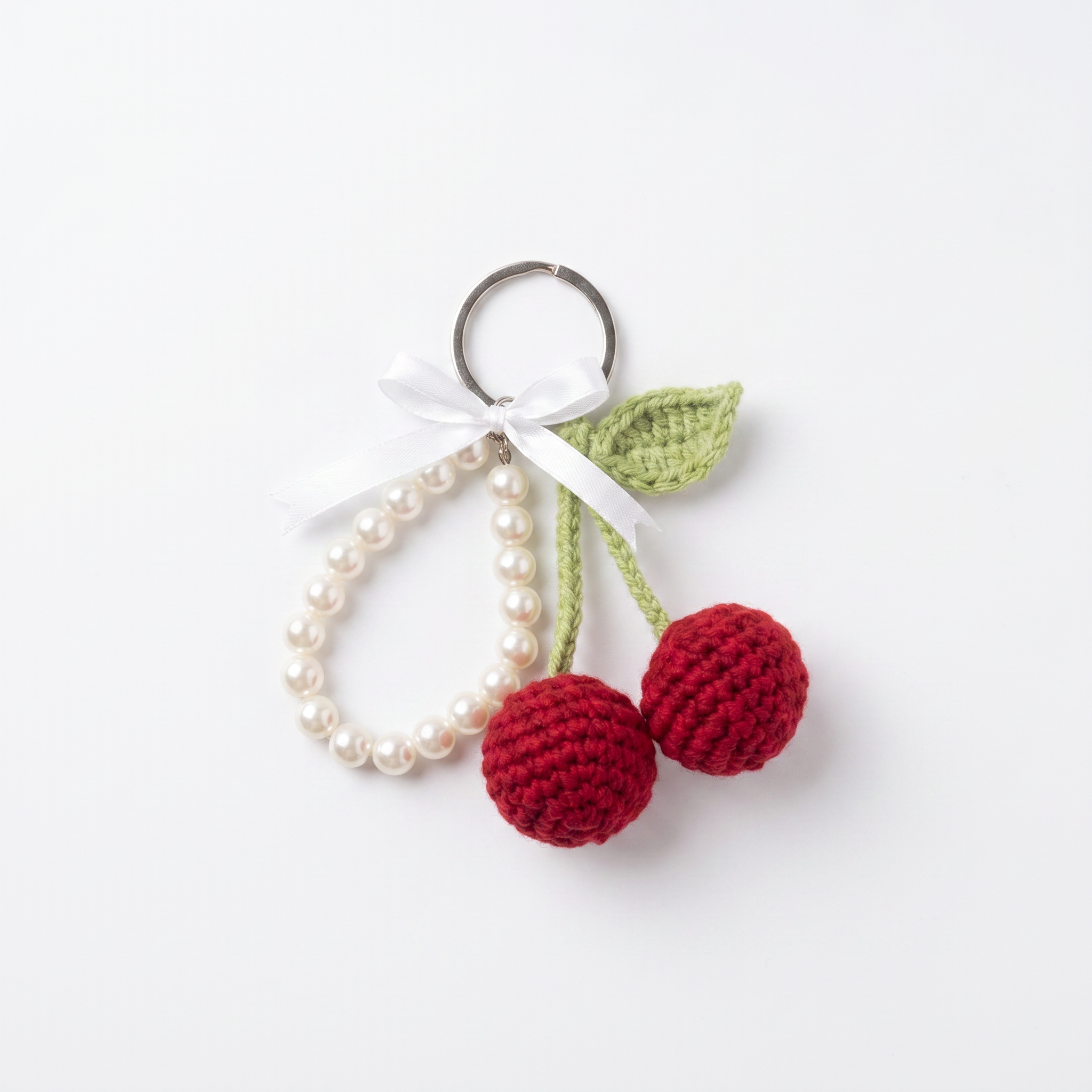 Cherry Pearl Crochet Keychain on a clean white background