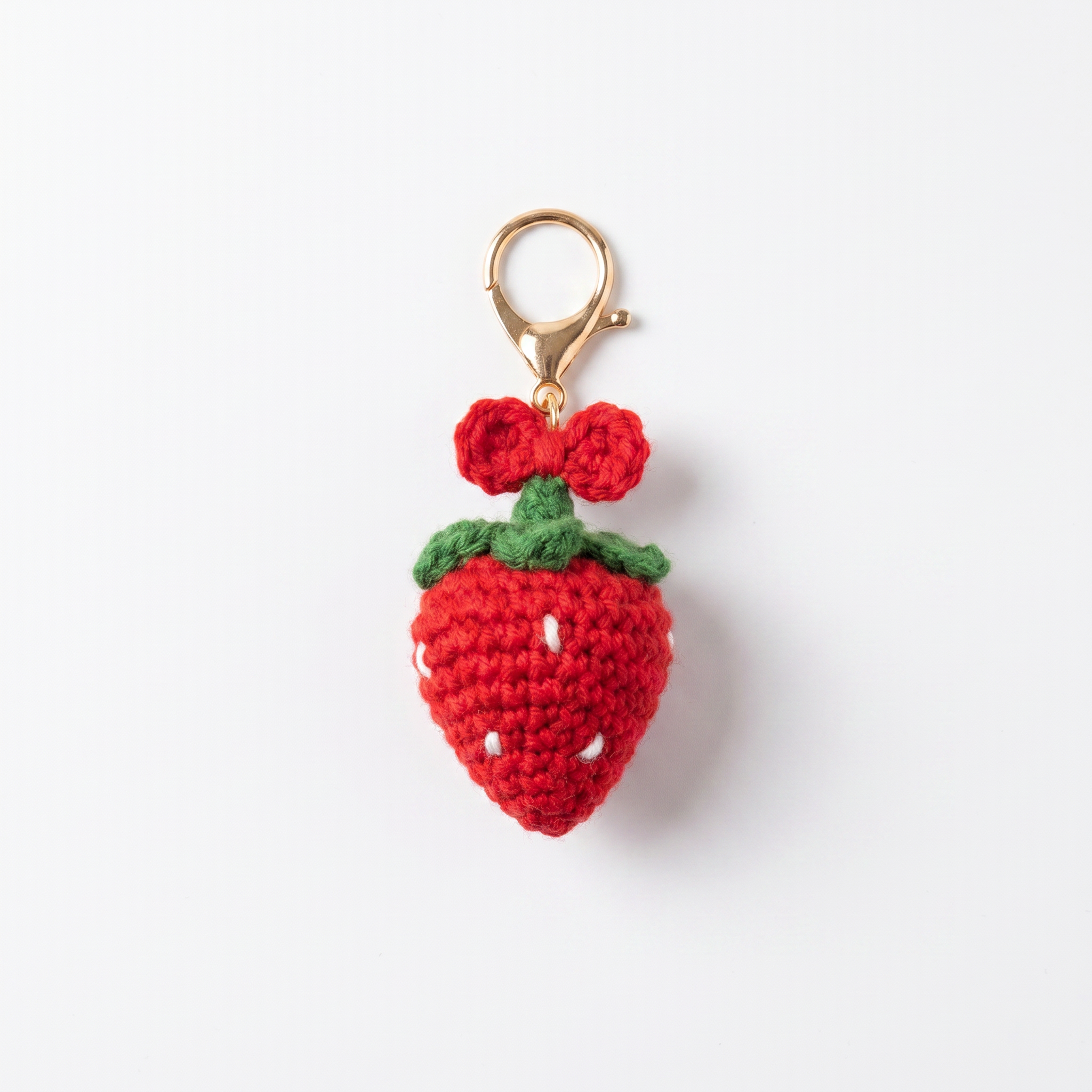 Strawberry Bow Crochet Keychain on a clean white background