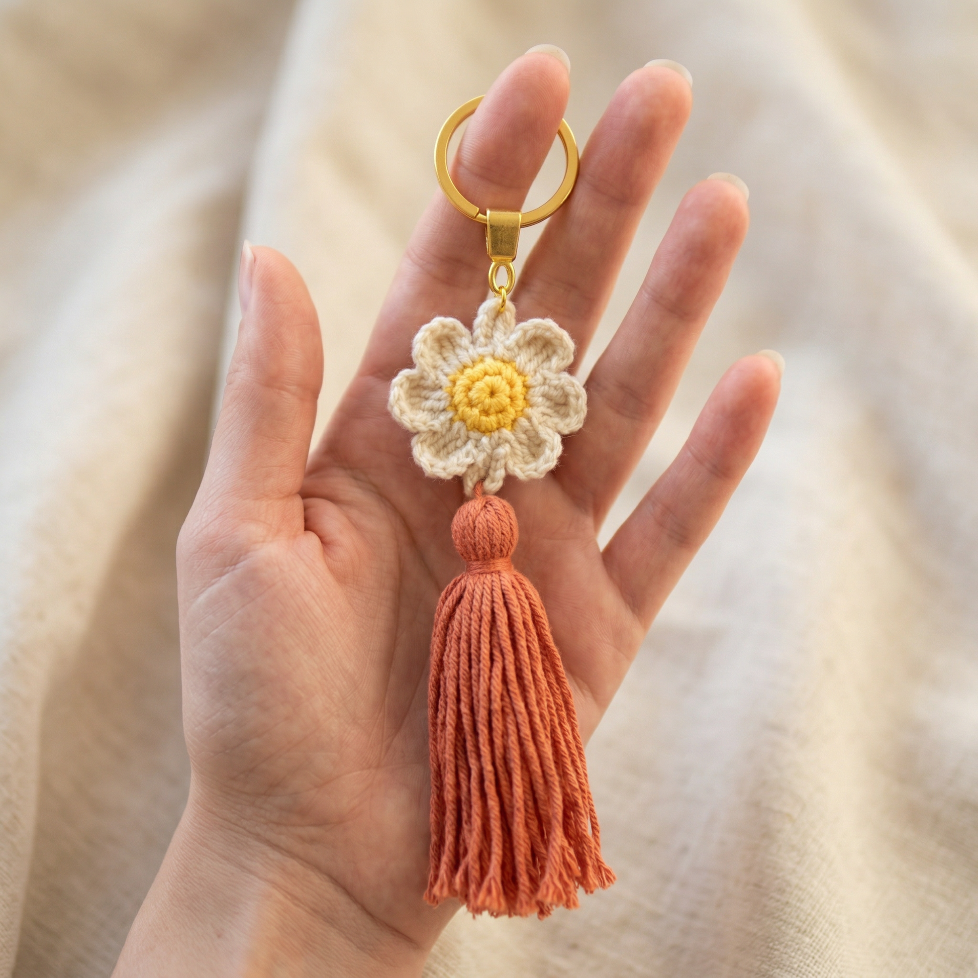 Lady Flower Crochet Keychain held in hand to show scale