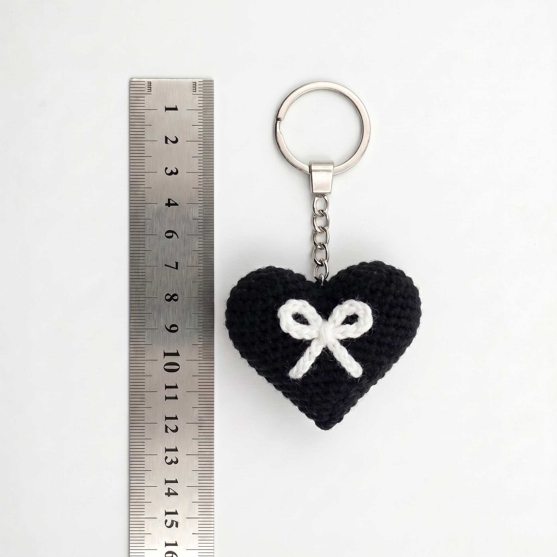 White Bow Heart Crochet Keychain during the handmade crochet process