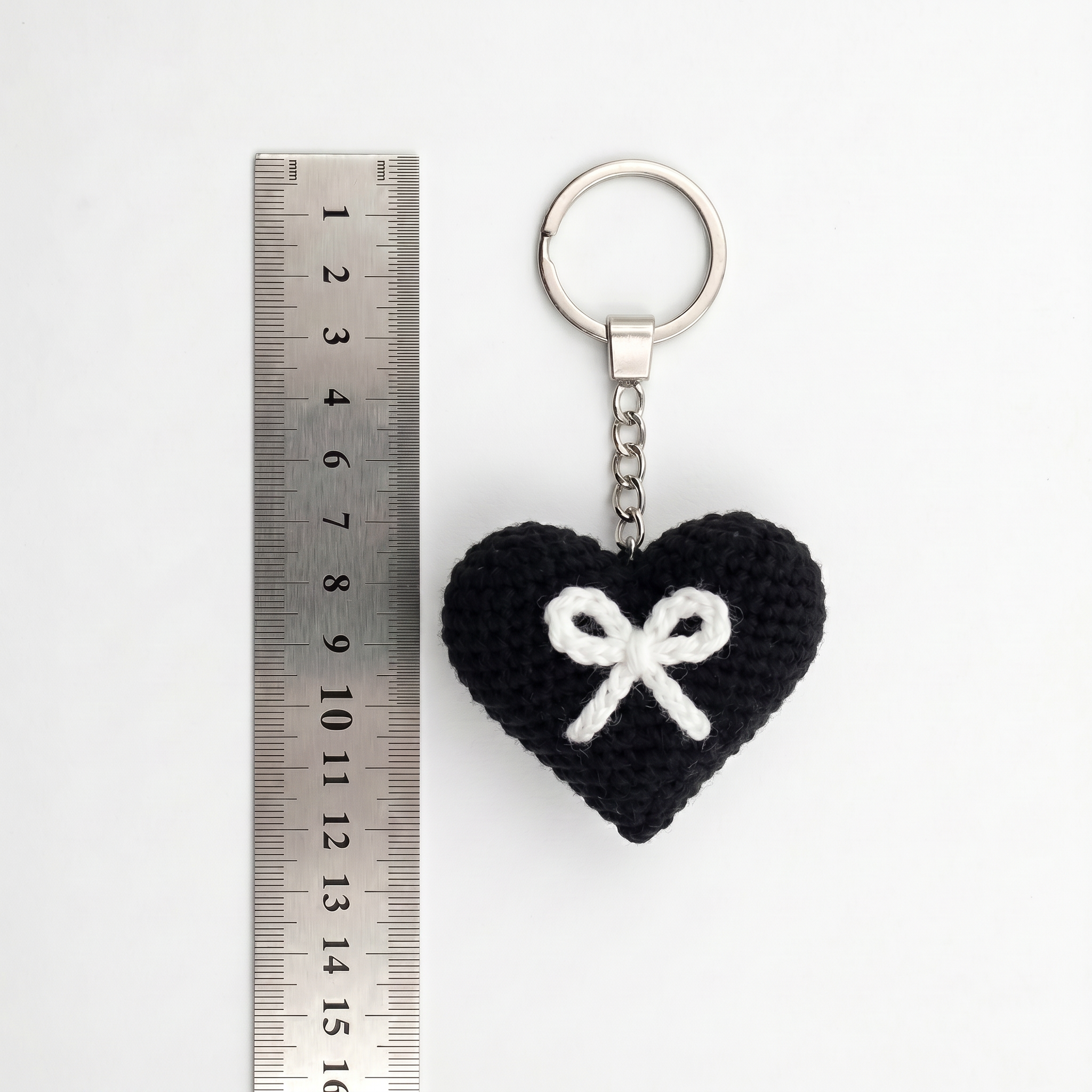 White Bow Heart Crochet Keychain during the handmade crochet process