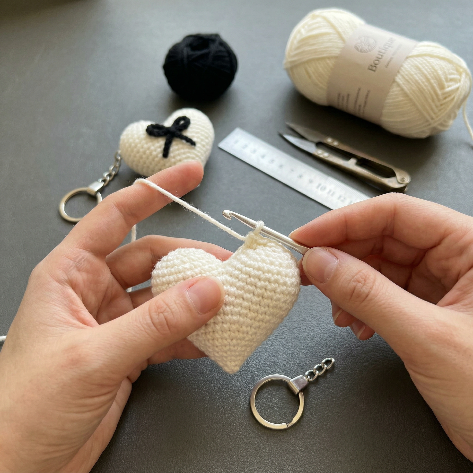 Black Bow Heart Crochet Keychain during the handmade crochet process