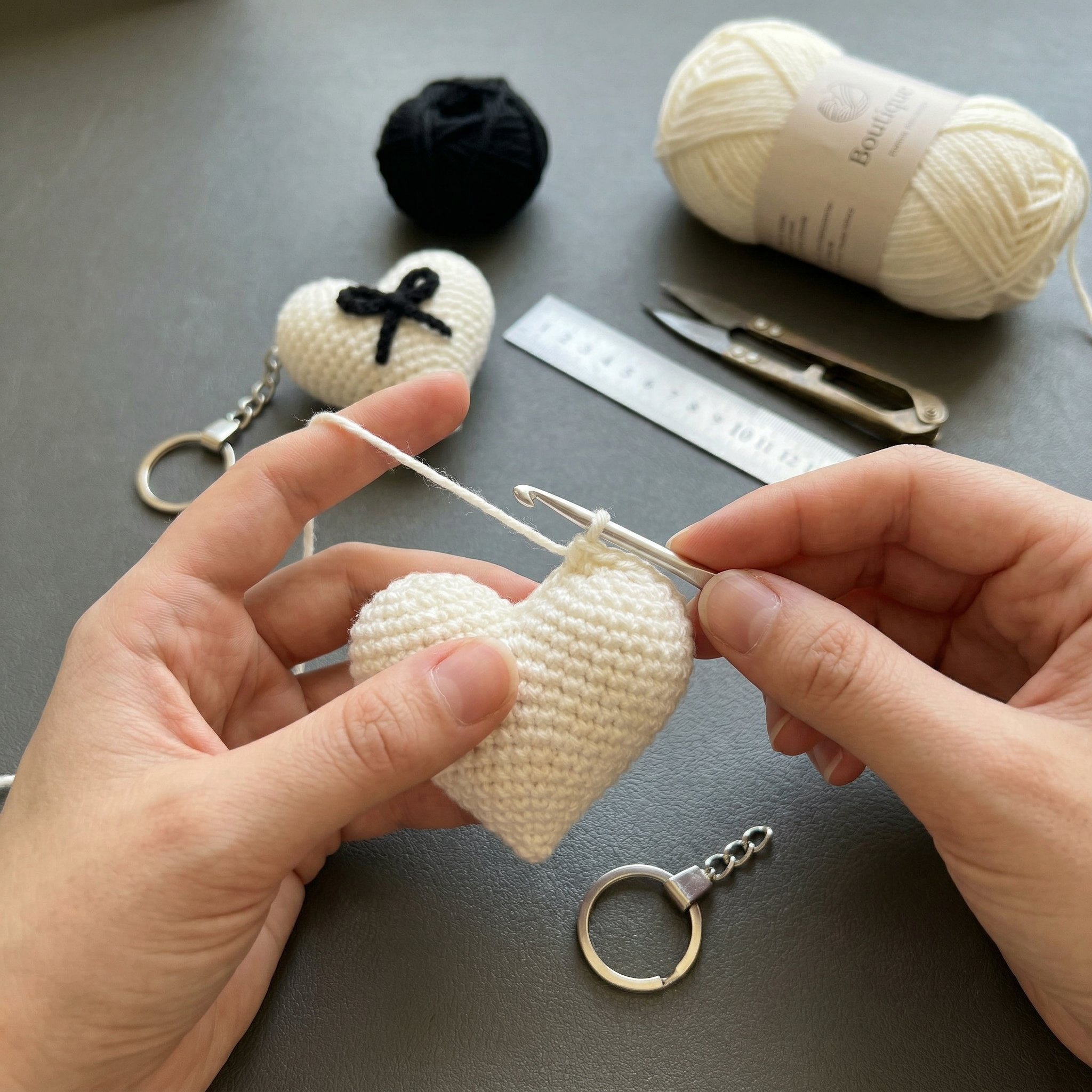 Black Bow Heart Crochet Keychain during the handmade crochet process