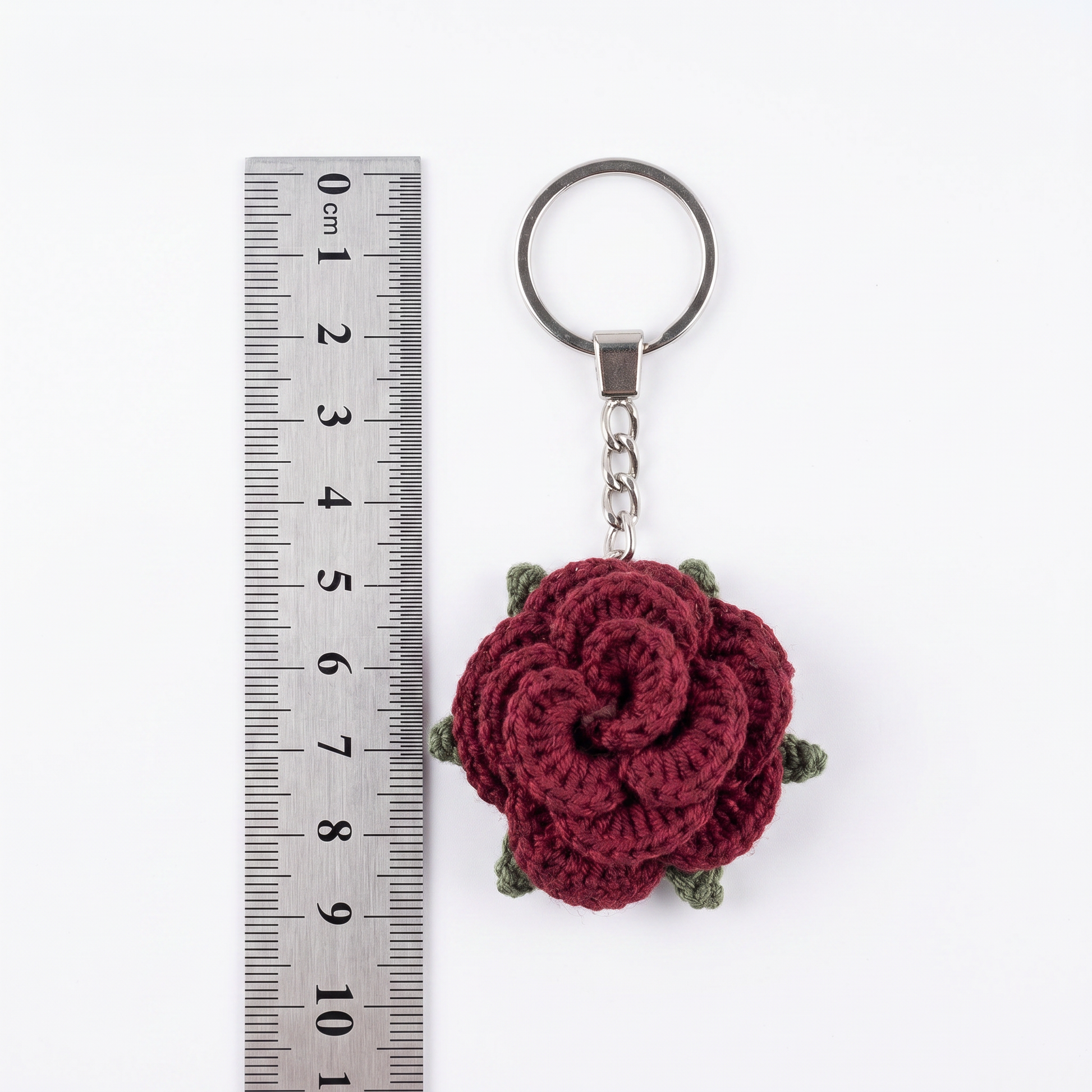 Burgundy Little Rose Crochet Keychain during the handmade crochet process