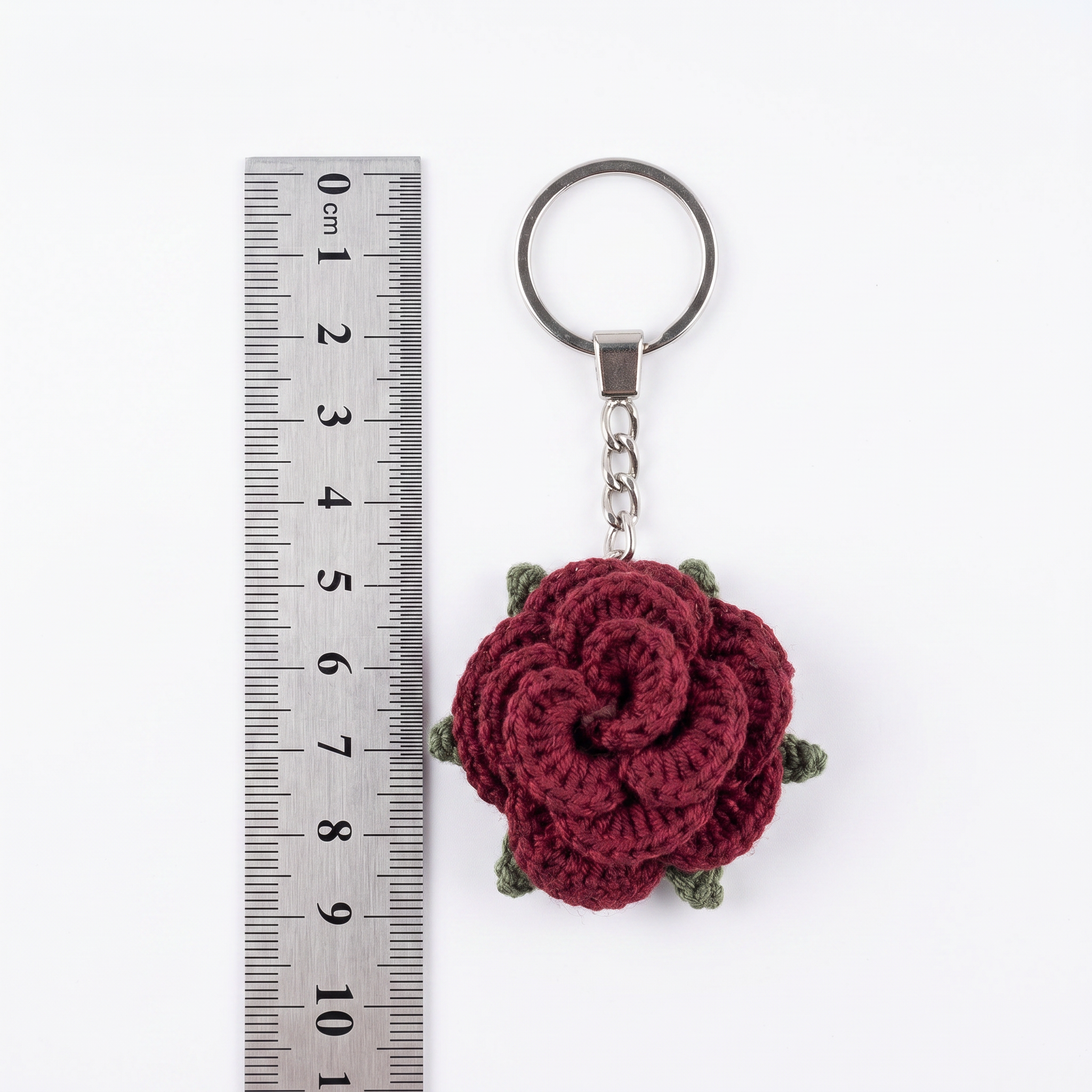 Burgundy Little Rose Crochet Keychain during the handmade crochet process