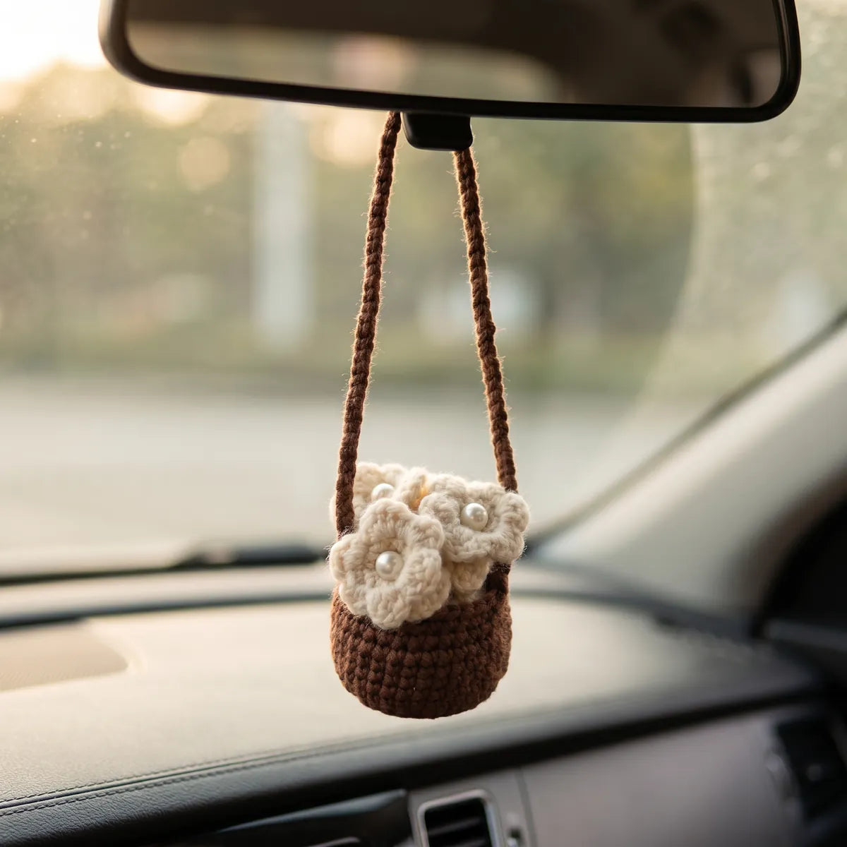BerryBow white basket crochet car charm styled in a car